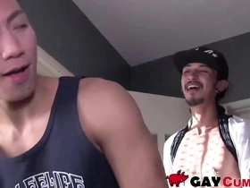 A slim Asian guy eagerly takes a hairy cock in his mouth