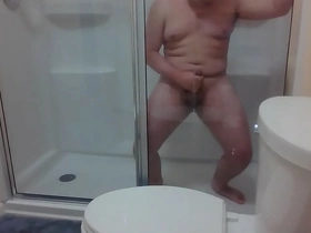 Gay amateur enjoys solo pleasure in hotel shower